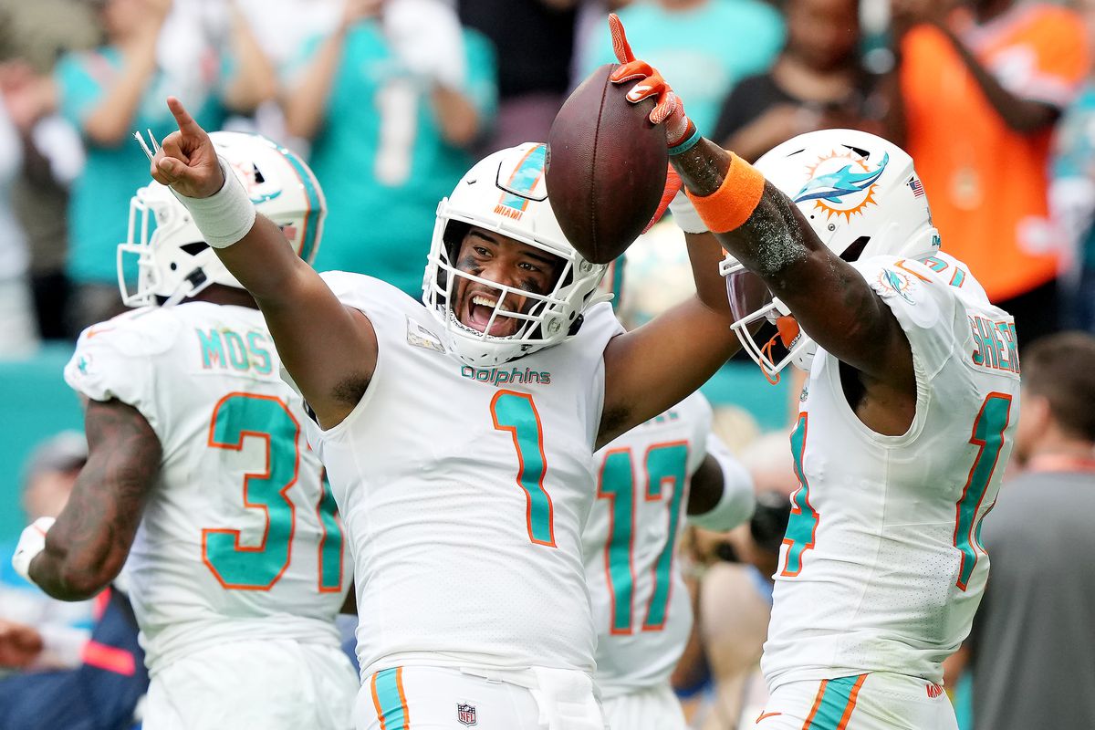 Tua Tagovailoa #1 and Trent Sherfield #14 of the Miami Dolphins celebrate after a touchdown in the second quarter of the game against the Cleveland Browns at Hard Rock Stadium on November 13, 2022 in Miami Gardens, Florida.