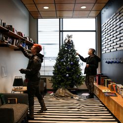 Kent Clair, 19, Isadora Zurie, 21, hang out in the library at the Volunteers of America-Utah Youth Resource Center in Salt Lake City on Wednesday, Dec. 14, 2016. Clair and Zurie are both homeless and living at the center.