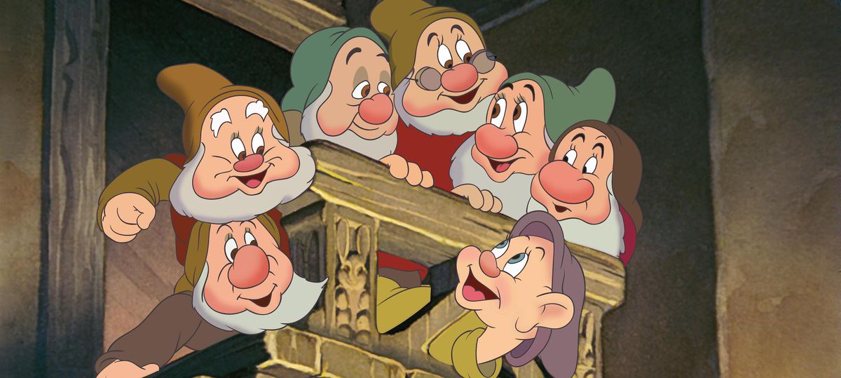 The seven dwarfs from Disney’s 1937 animated feature Snow White and the Seven Dwarfs all crowd onto a wooden balcony together