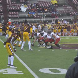 The NIU offense sets up against the CMU defense.