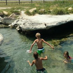 Arianne Brown's children playing in the pools of Meadow Hot Springs.