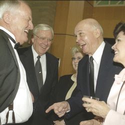 Former BYU head football coach LaVell Edwards laughs with Elder Russell M. Ballard and Dallin H. Oaks of the Quorum of the Twelve Apostles of The Church of Jesus Christ of Latter-day Saints during a tribute April 11, 2001.