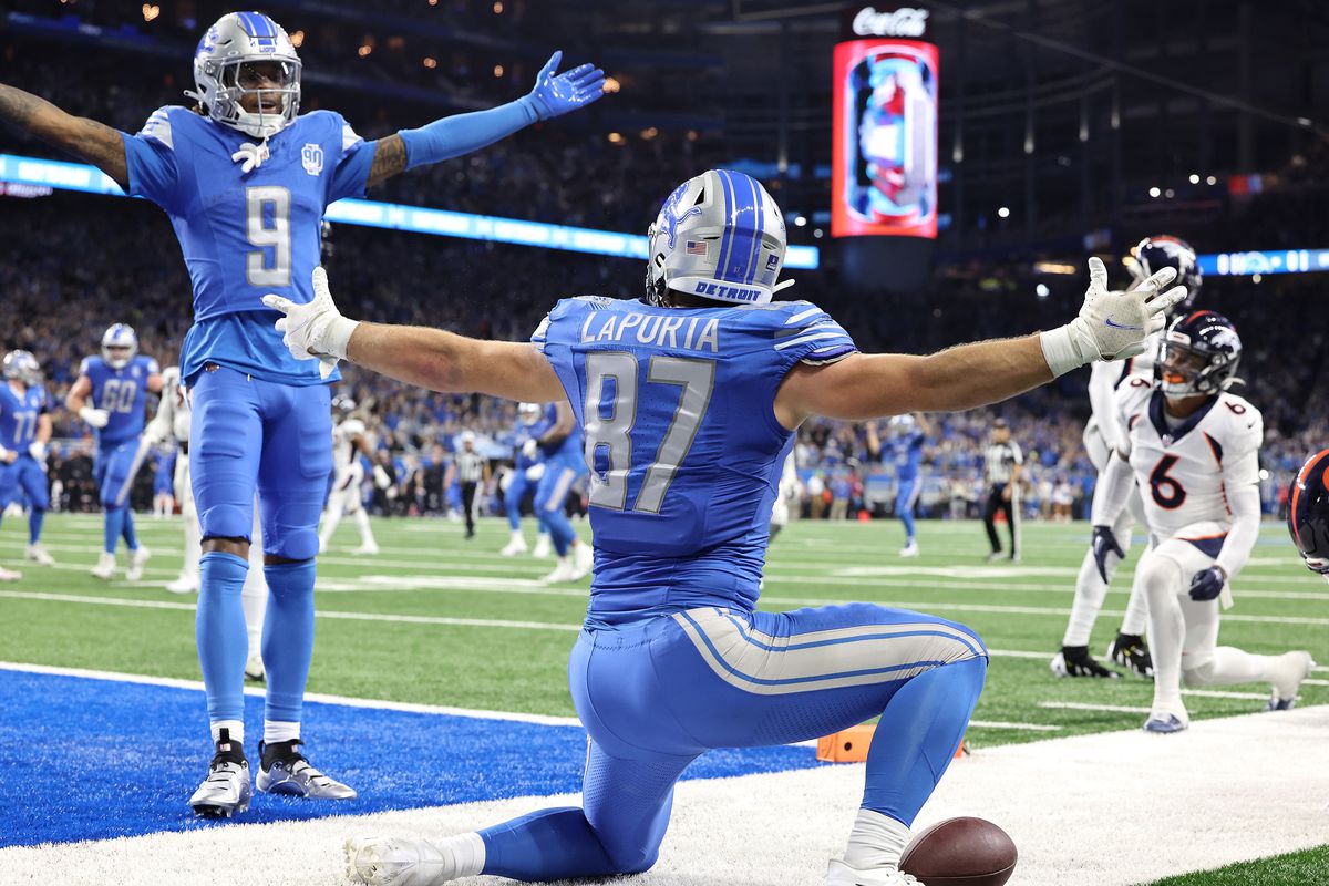 Sam LaPorta #87 of the Detroit Lions celebrates his touchdown with Jameson Williams #9 during the second quarter against the Denver Broncos at Ford Field on December 16, 2023 in Detroit, Michigan.