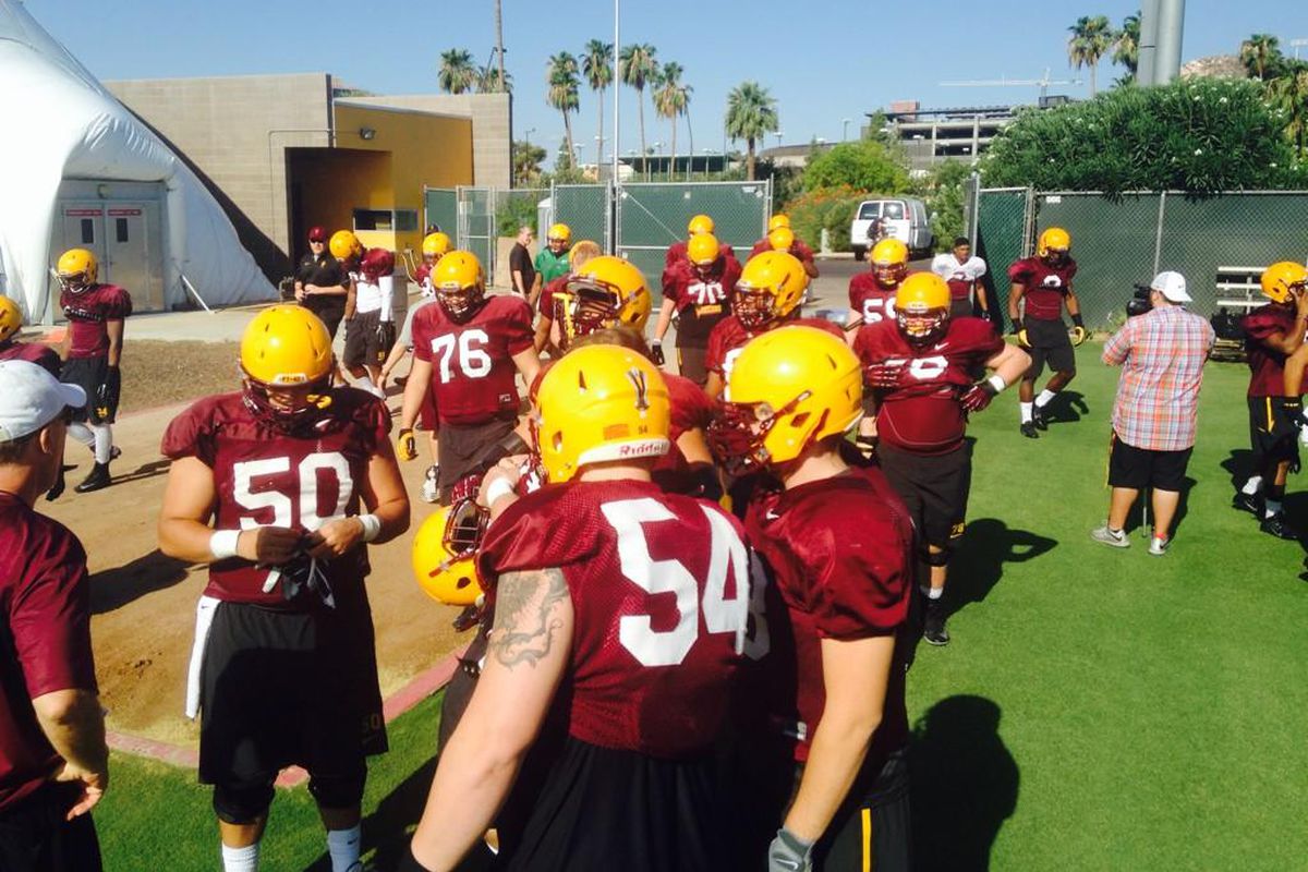 Center Nick Kelly and right tackle Tyler Sulka get ready for practice Sunday.