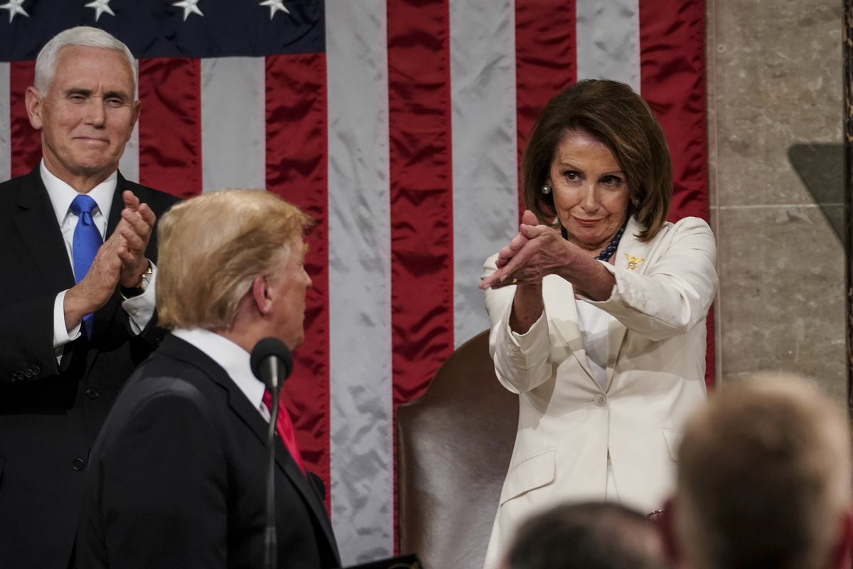President Donald Trump turns to House Speaker Nancy Pelosi, D-Calif., as he delivers his State of the Union address to a joint session of Congress on Capitol Hill in Washington, D.C., as Vice President Mike Pence watches on Tuesday, Feb. 5, 2019.