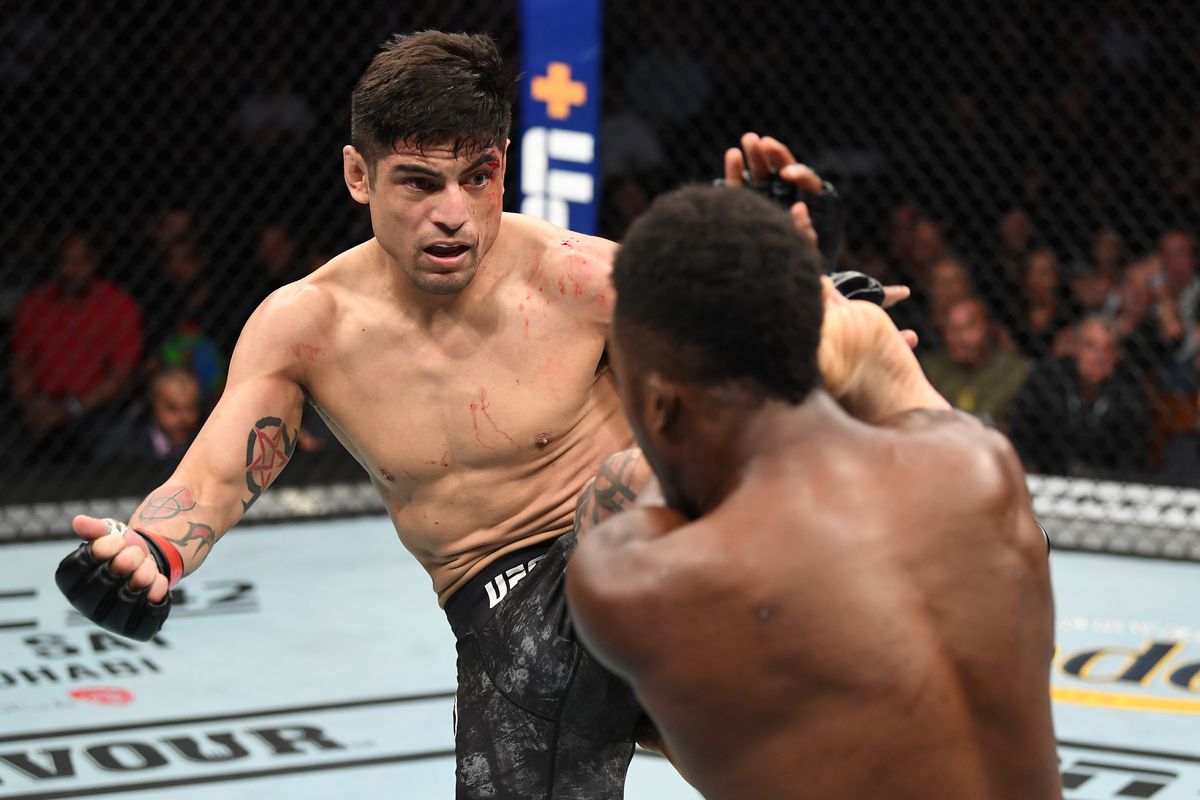 Gabriel Benitez of Mexico kicks Sodiq Yusuff of Nigeria in their featherweight bout during the UFC 241 event at the Honda Center on August 17, 2019 in Anaheim, California.