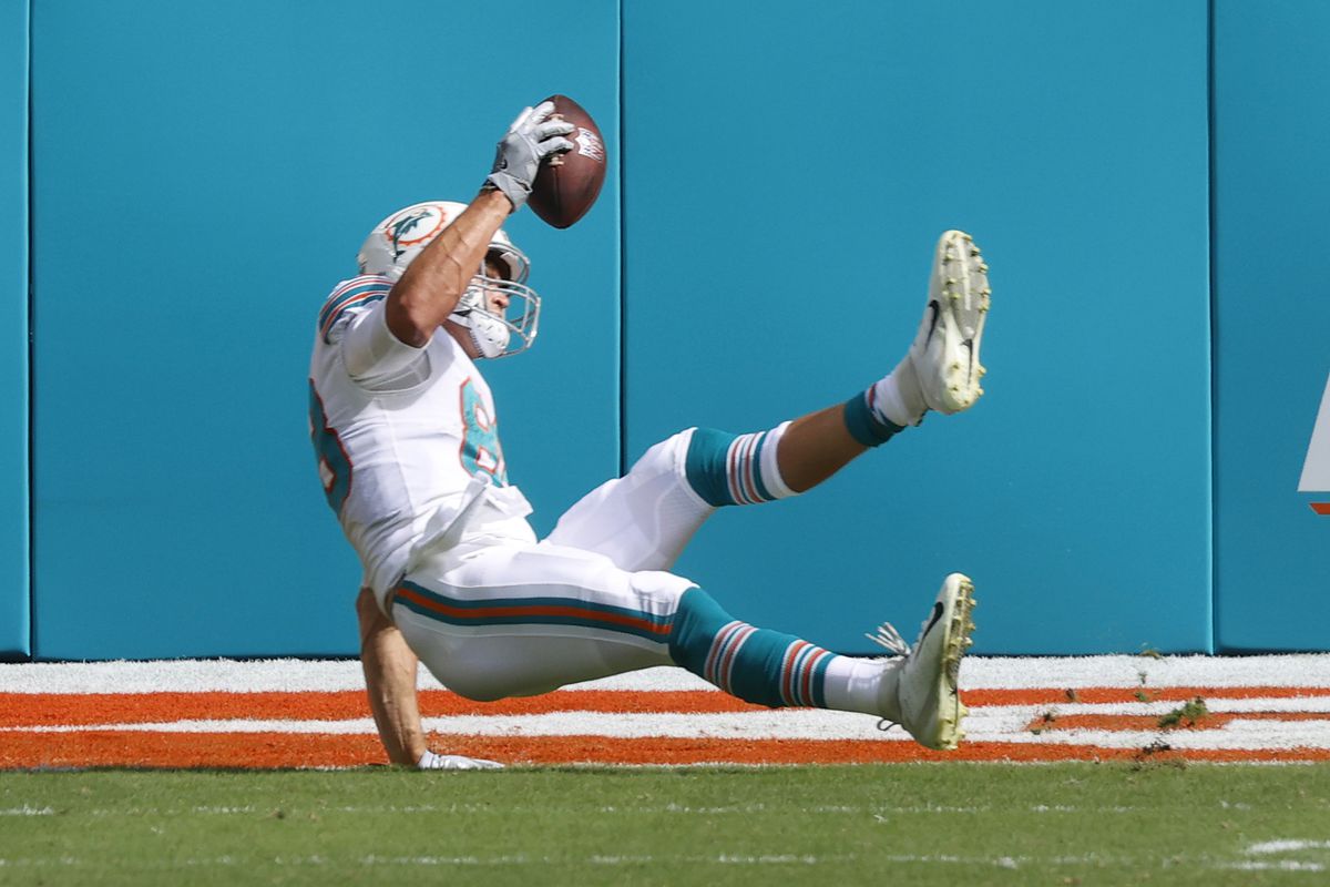 Mike Gesicki #88 of the Miami Dolphins catches the ball for a touchdown against the Indianapolis Colts during an NFL game on October 3, 2021 at Hard Rock Stadium in Miami Gardens, Florida.