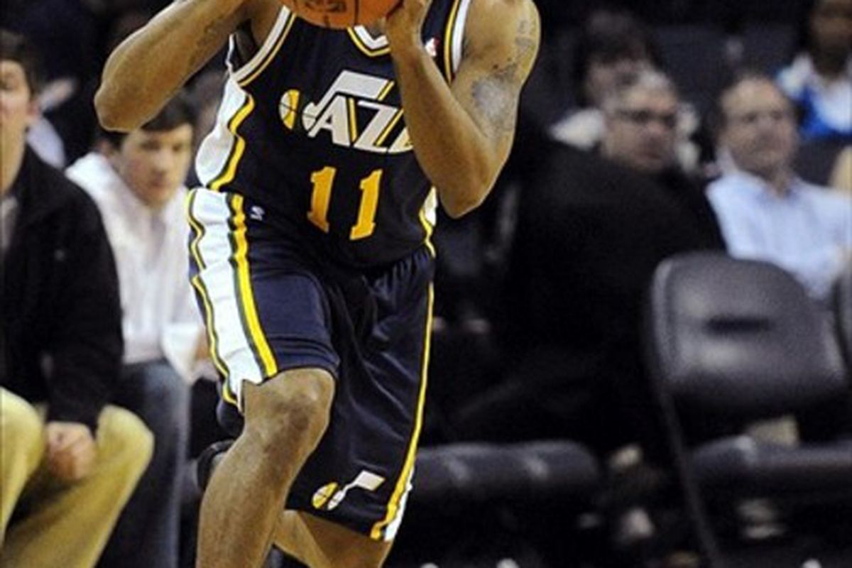 March 7, 2012; Charlotte, NC, USA; Utah Jazz guard Earl Watson (11) prepares to pass the ball during the game against the Charlotte Bobcats at Time Warner Cable Arena. Mandatory Credit: Sam Sharpe-US PRESSWIRE