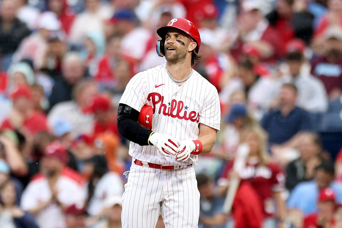 Bryce Harper of the Philadelphia Phillies reacts after hitting an RBI single during the first inning against the New York Mets at Citizens Bank Park on June 23, 2023 in Philadelphia, Pennsylvania.