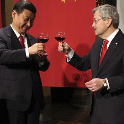 FILE - In this Feb. 15, 2012 file-pool photo, Chinese Vice President Xi Jinping and Iowa Gov. Terry Branstad raise their glasses at the beginning of a formal dinner in the rotunda at the Iowa Statehouse in Des Moines, Iowa. Branstad, President-elect Donald Trump's choice for U.S. ambassador to China, can boast a 30-year relationship with Chinese President Xi Jinping, the most powerful Chinese leader in decades, especially amid escalating talk of a trade war with the U.S.’s largest trading partner?  