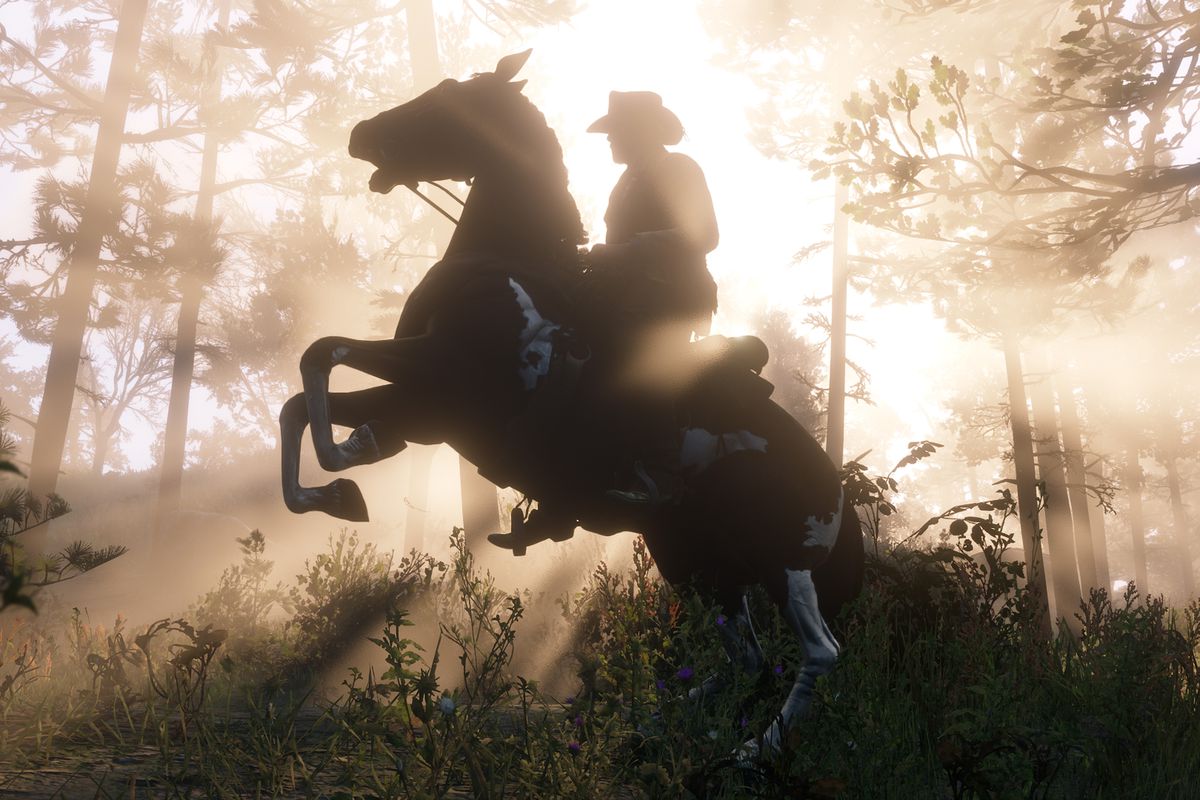 Red Dead Redemption 2 - Arthur’s horse rearing up in the forest as the sun shines behind them