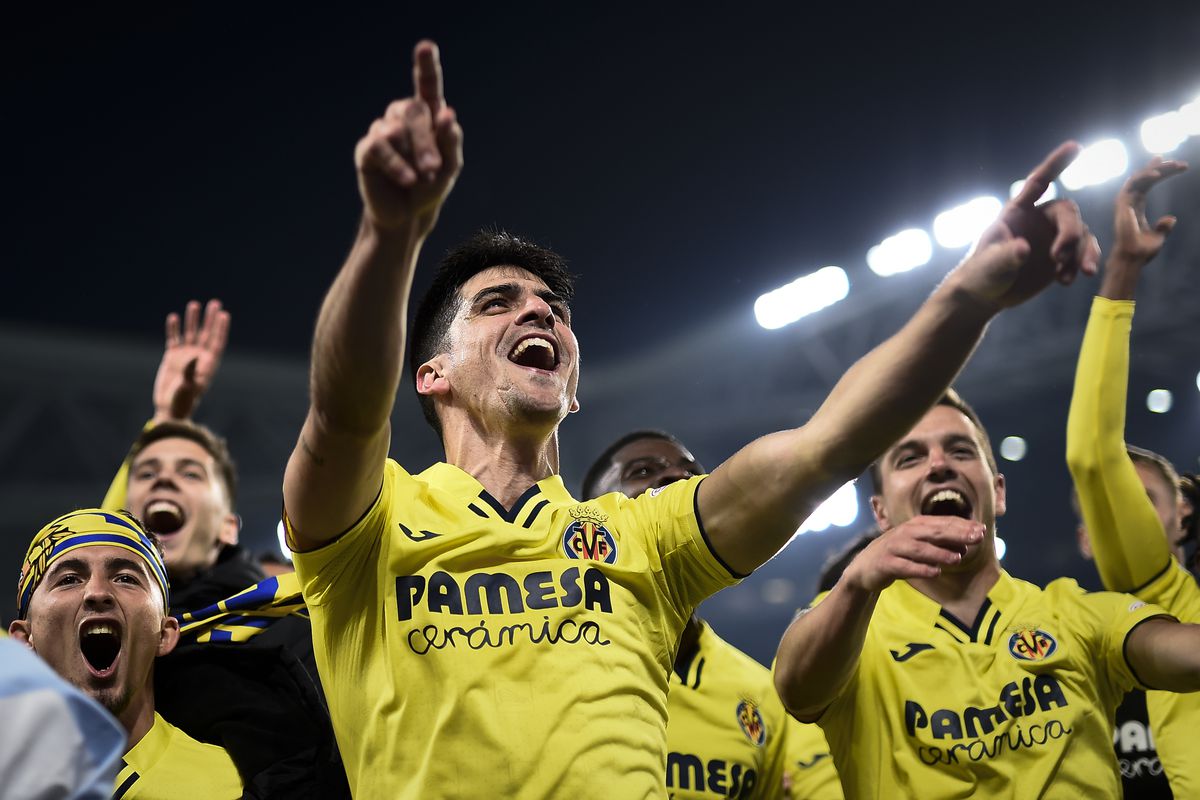 Gerard Moreno (C) of Villarreal CF celebrates the victory at...