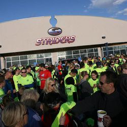 A huge crowd of runners gather prior to the start of a 5K race to remember and support the victims of the Boston Marathon bombings, as Striders Running Store in Layton Monday, April 22, 2013.