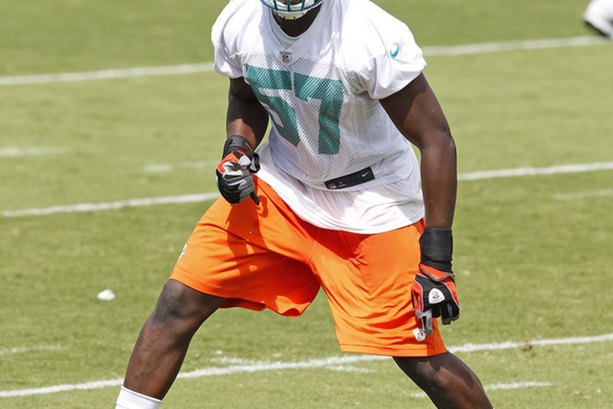 DAVIE, FL - MAY 4:  Josh Kaddu #57 of the Miami Dolphins works out during the rookie minicamp on May 4, 2012 at the Miami Dolphins training facility in Davie, Florida. (Photo by Joel Auerbach/Getty Images)