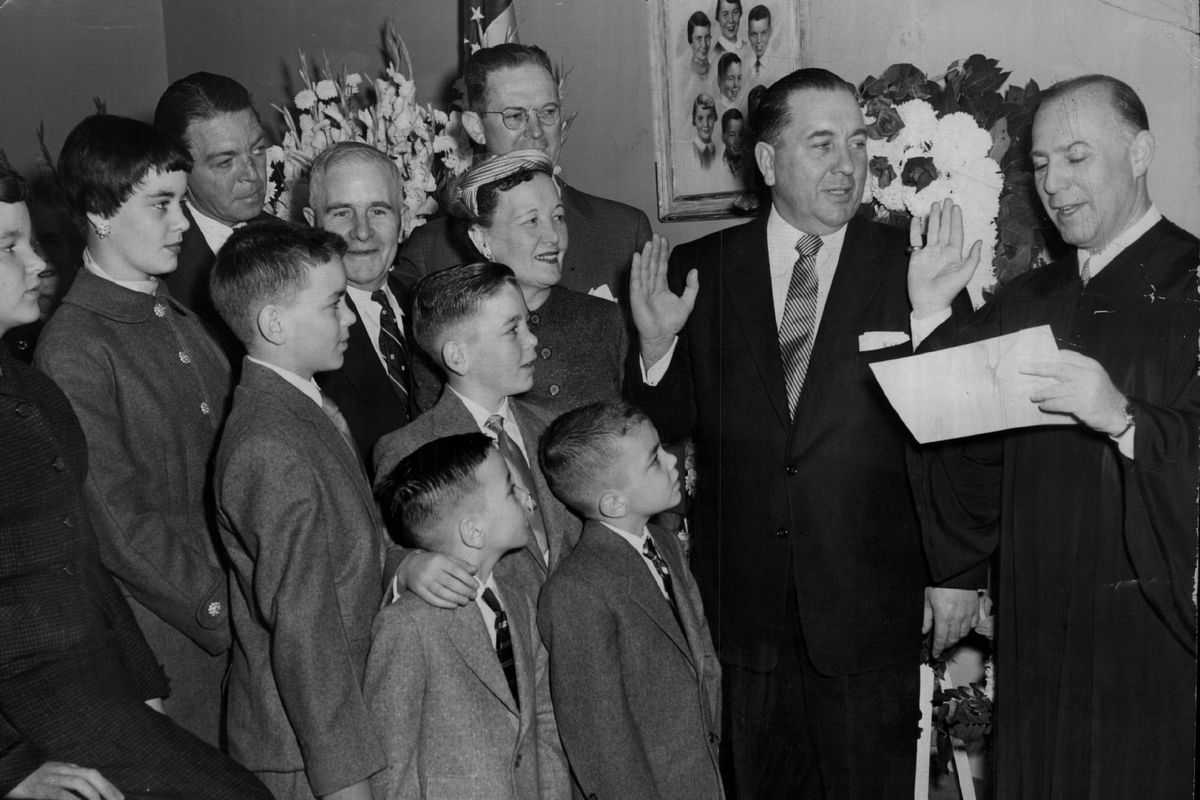 Richard J. Daley, second from right, takes the oath for his second term as Cook County clerk in 1954.