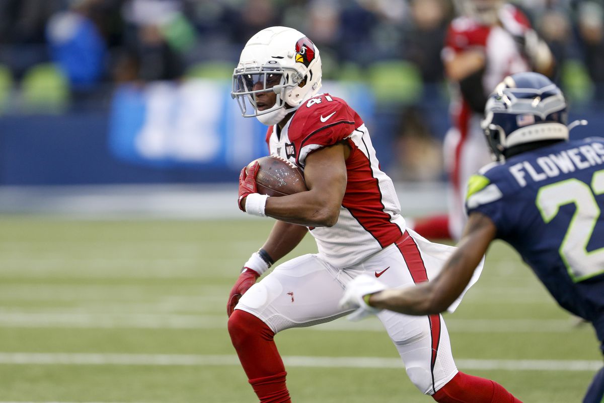 Arizona Cardinals running back Kenyan Drake runs for yards after the catch against the Seattle Seahawks during the second quarter at CenturyLink Field.