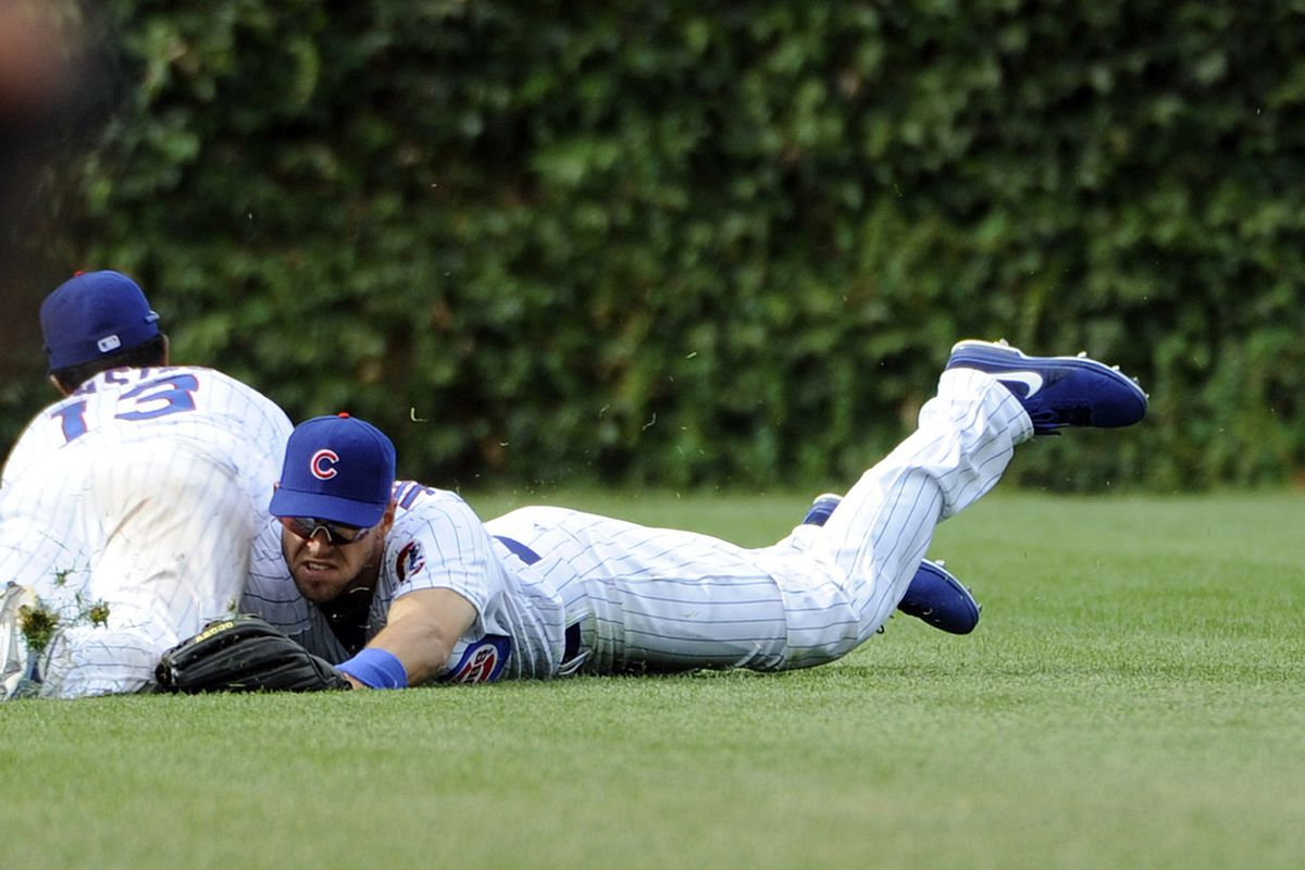 Brett Jackson of the Chicago Cubs and Starlin Castro of the Chicago Cubs collide going for a ball against the Cincinnati Reds at Wrigley Field in Chicago, Illinois. The Reds won 10-8. (Photo by David Banks/Getty Images) 