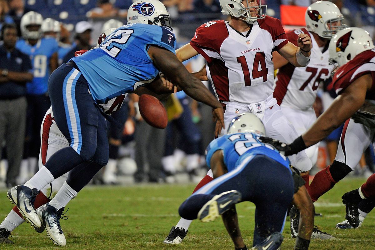 NASHVILLE, TN - AUGUST 23:  DaJohn Harris #62 of the Tennessee Titans causes Ryan Lindley #14 of the Arizona Cardinals to fumble the ball at LP Field on August 23, 2012 in Nashville, Tennessee.  (Photo by Frederick Breedon/Getty Images)