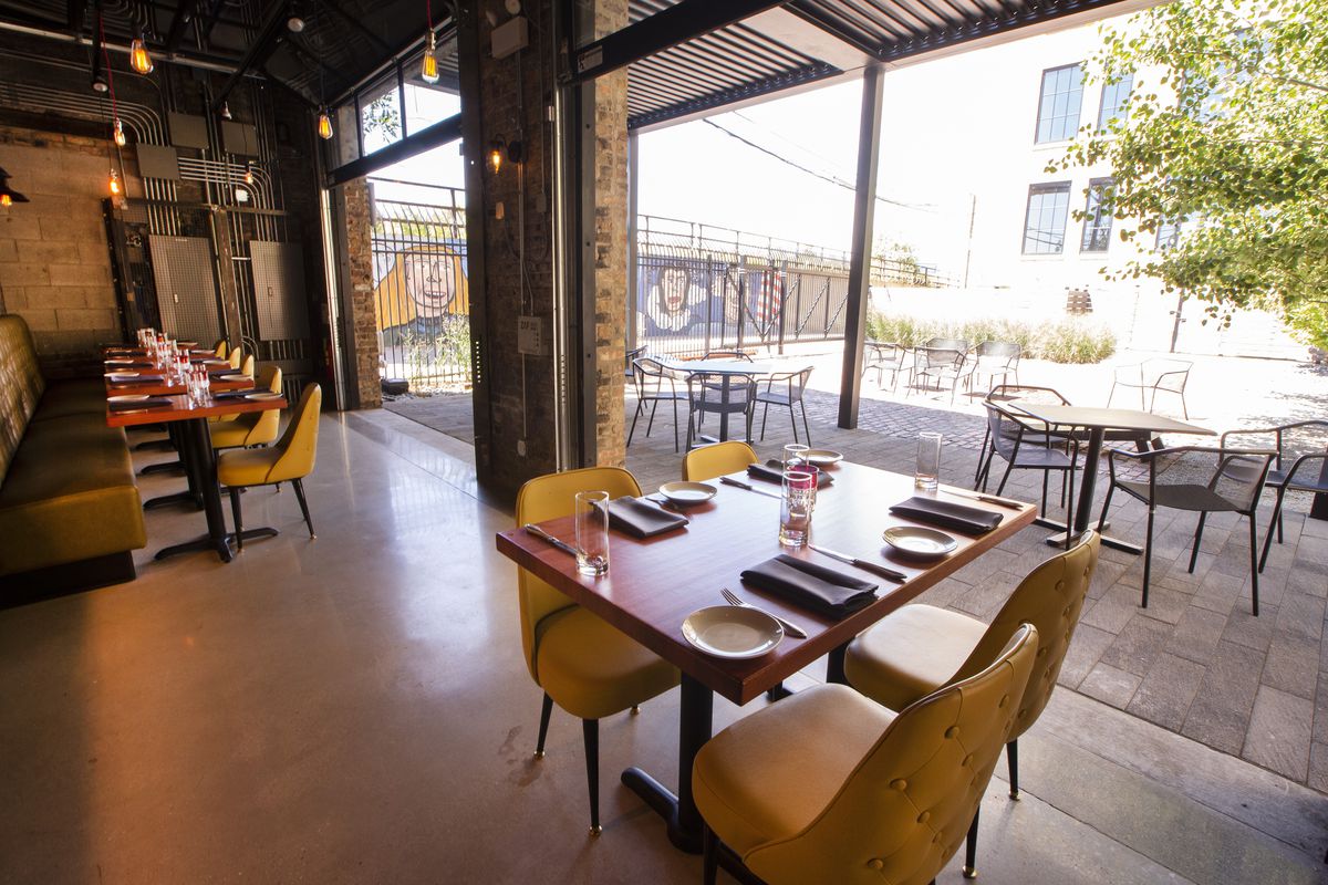 An indoor-outdoor dining room with retractable walls.