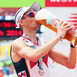 Timo Bracht of Germany celebrates winning the Challenge Roth on July 20, 2014 in Roth, Germany. (Photo by Alex Grimm/Getty Images)