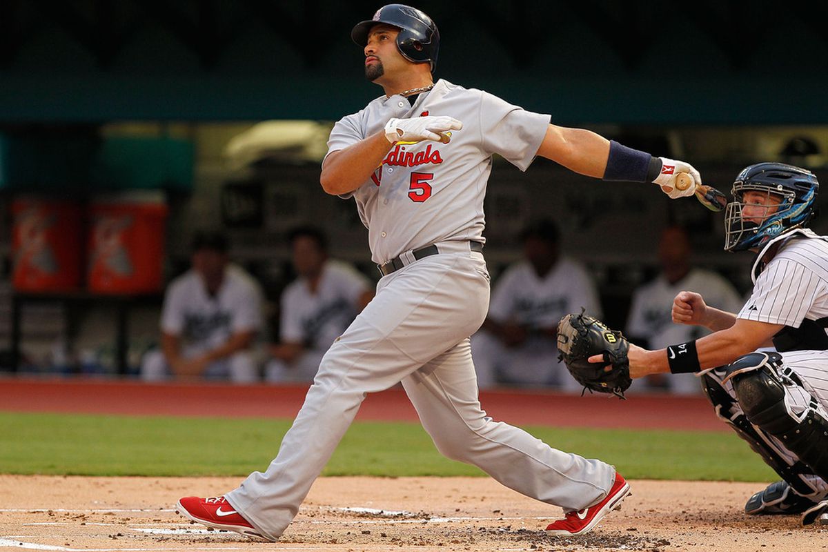 MIAMI GARDENS, FL - AUGUST 06:  Albert Pujols #5 of the St. Louis Cardinals hits a two run home run during a game against the Florida Marlins at Sun Life Stadium on August 6, 2011 in Miami Gardens, Florida.  (Photo by Mike Ehrmann/Getty Images)