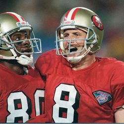 San Francisco 49ers quarterback Steve Young (8) celebrates with wide receiver Jerry Rice after a third quarter Super Bowl XXIX Young-to-Rice touchdown pass, Sunday Jan. 29, 1995 at Joe Robbie Stadium in Miami.
