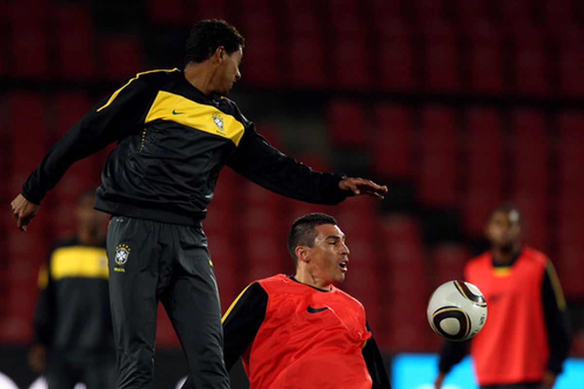 Kleberson, on the left, vies for the ball against Lucio in a Brazilian national team practice at the 2010 World Cup in South Africa.