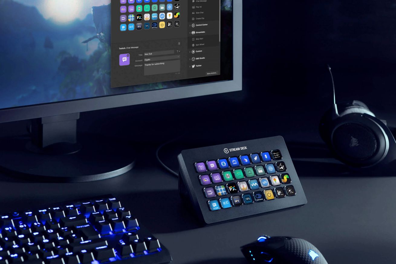 An Elgato Stream Deck XL sitting on a black desk and connected to a computer.