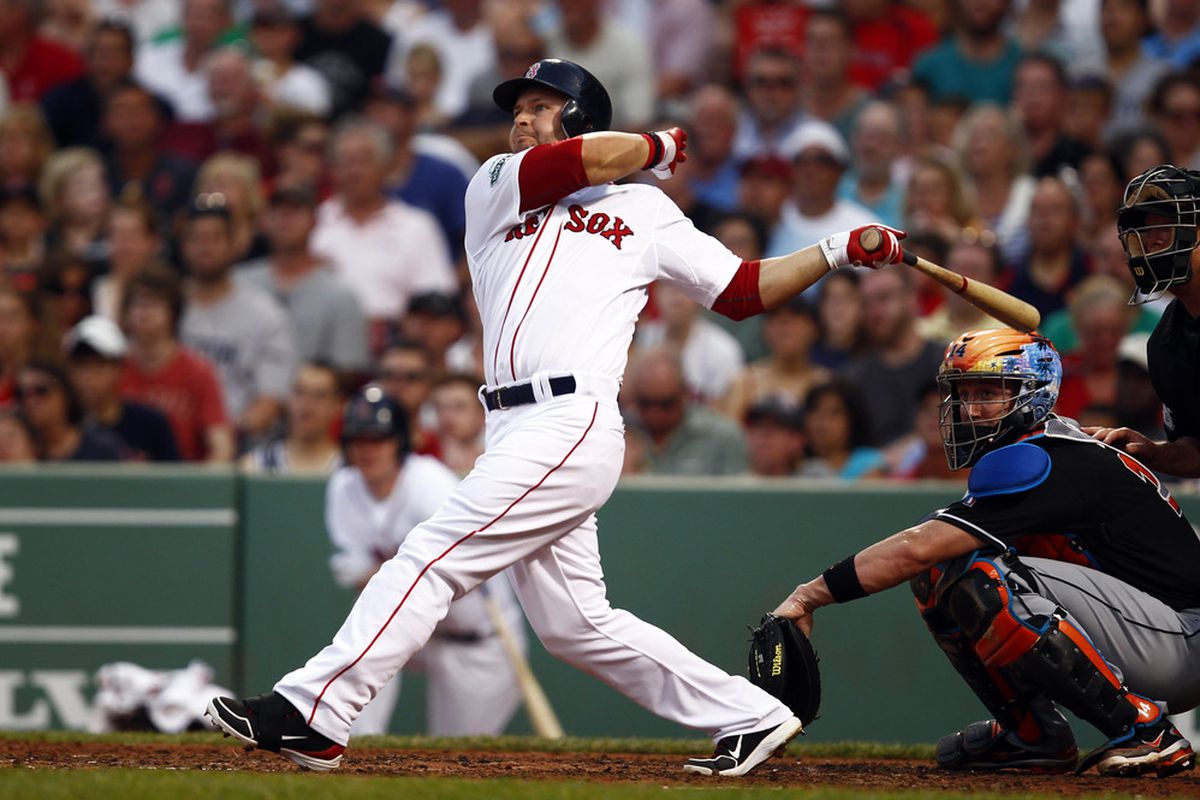 Jun 20, 2012; Boston, MA, USA;  Boston Red Sox right fielder Cody Ross (7) hits a 3-run double against the Miami Marlins during the third inning at Fenway Park.  Mandatory Credit: Mark L. Baer-US PRESSWIRE