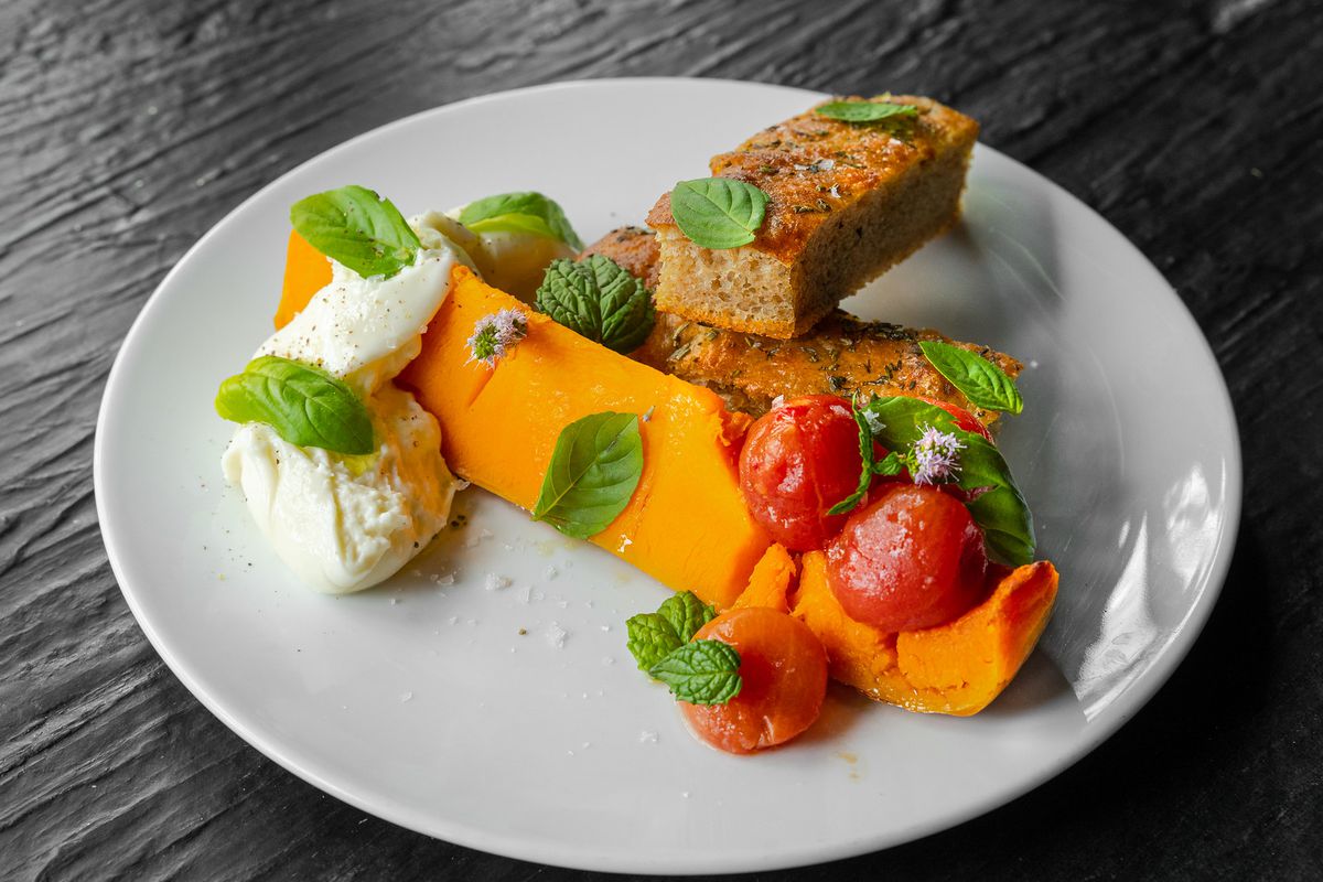 A veggie dish featuring a carrot.