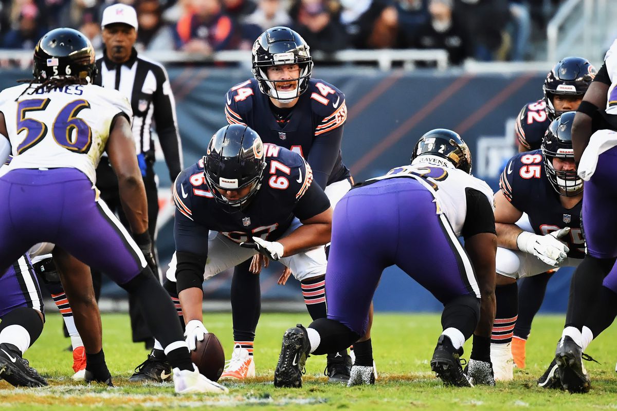 Quarterback Andy Dalton #14 of the Chicago Bears calls signals against the Baltimore Ravens at Soldier Field on November 21, 2021 in Chicago, Illinois.