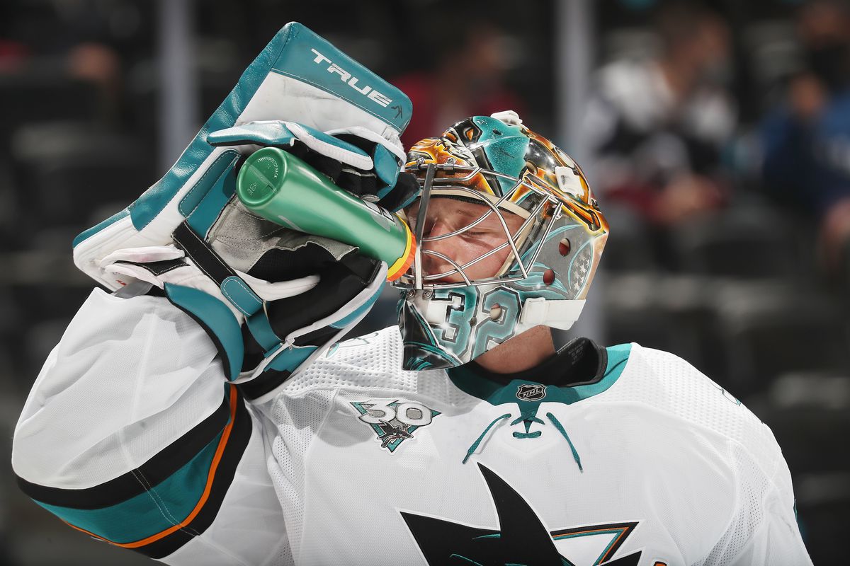 Goaltender Josef Korenar #32 of the San Jose Sharks drinks from a Gatorade bottle during a break in the action against the Colorado Avalanche at Ball Arena on May 1, 2021 in Denver, Colorado.