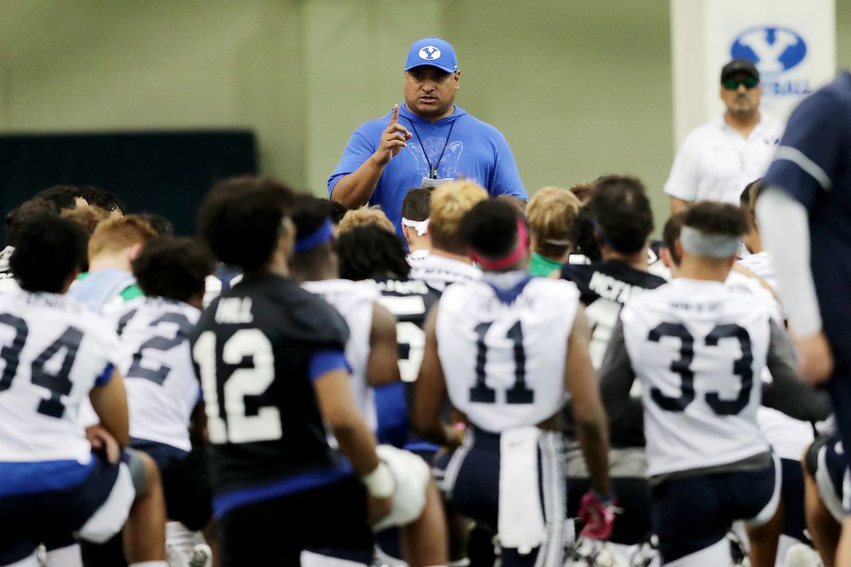 Head football coach, Kalani Sitake talks to his team after BYU opened football practice at the indoor facility in Provo on Wednesday, July 31, 2019.