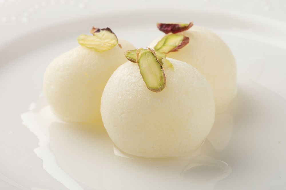 Rasgulla are boiled rather than fried before being steeped in a fragrant sticky syrup.