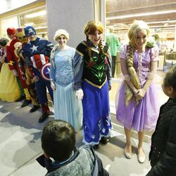 Volunteers dressed as movie characters greet young shoppers at Goodwill in Millcreek on Saturday, Dec. 3, 2016. The Rotary Club of Midvale partnered with the Unified Police Department for 102 needy children to shop.