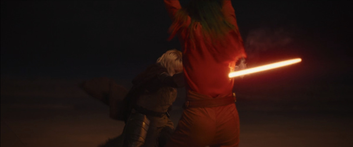 Sabine (Natasha Liu Bordizzo) getting stabbed by Hati’s (Ivanna Sakhno) lightsaber