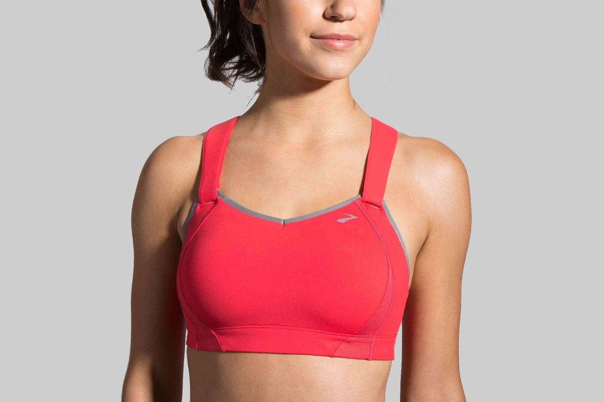 A model wearing a red sports bra