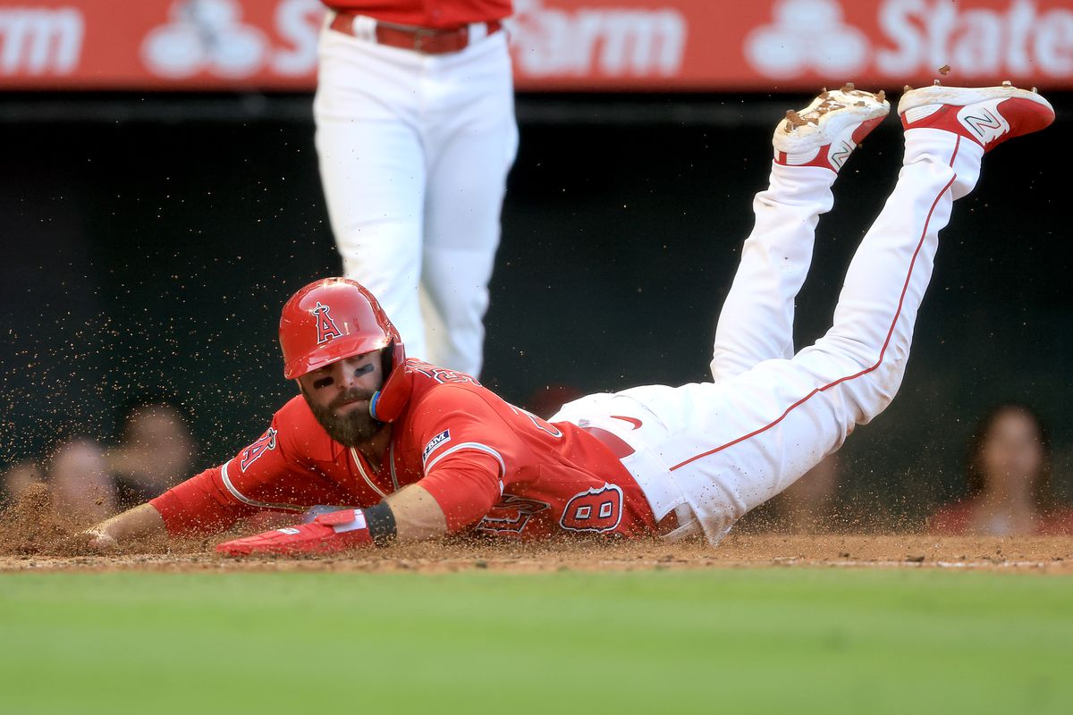 Michael Stefanic of the Los Angeles Angels scores on a pass ball during the third inning of a game against the New York Yankees at Angel Stadium of Anaheim on July 18. in Anaheim, California.
