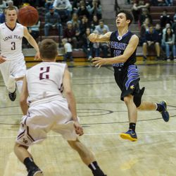 Pleasant Grove's Braden Wellman (15) with a big pass Tuesday night in PG's 78-71 win over Lone Peak.  