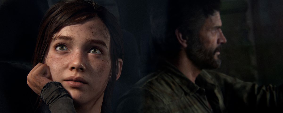 Ellie looks out the window of a truck while Joel drives in a screenshot from The Last of Us Part 1