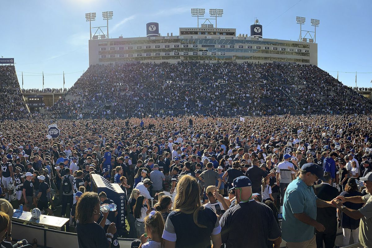BYU fans storm the field after BYU beat USC in Provo on Saturday, Sept. 14, 2019. BYU won 30-27 in overtime.