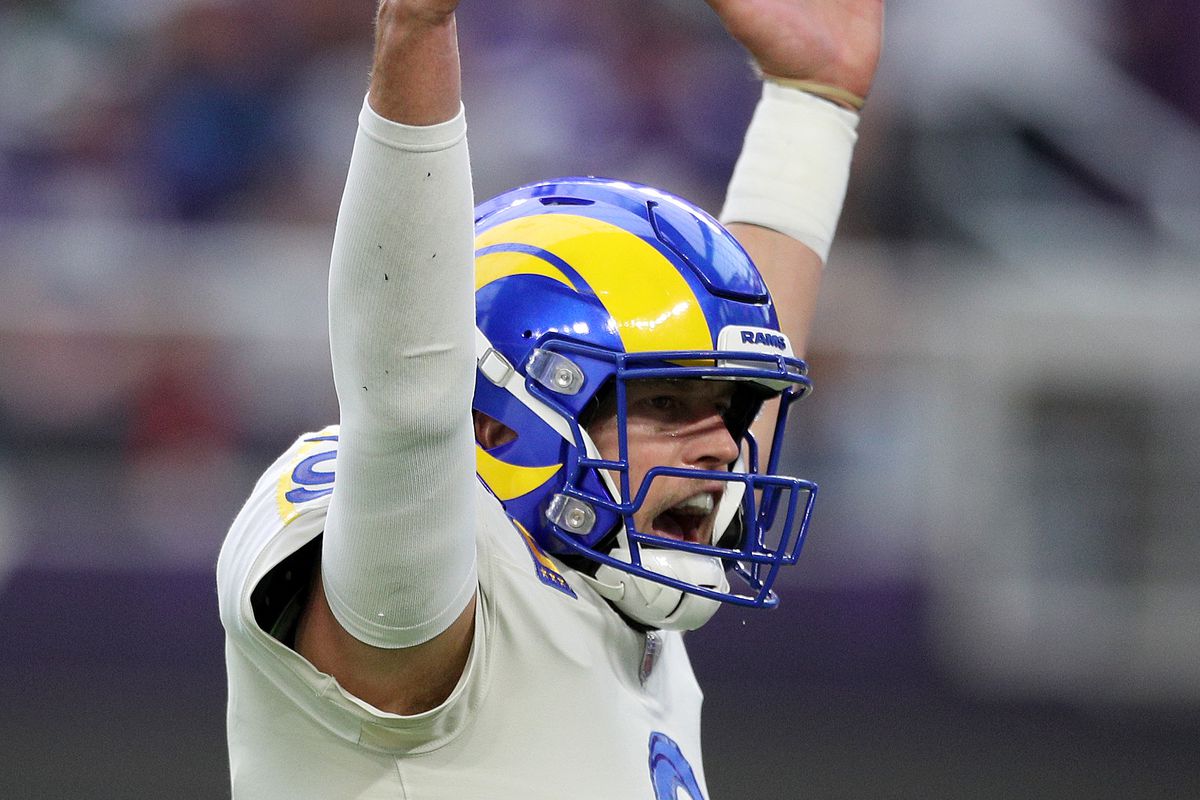 Matthew Stafford #9 of the Los Angeles Rams reacts after a Rams rushing touchdown in the first quarter against the Minnesota Vikings at U.S. Bank Stadium on December 26, 2021 in Minneapolis, Minnesota.
