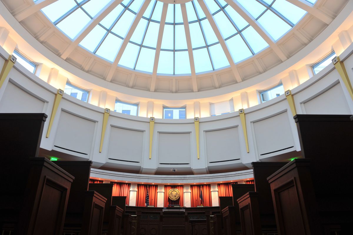 Photo shows half the ale blue glass dome and the upper level of the Colorado Supreme Court chambers at the Ralph Carr Judicial Center in Denver, Colorado.