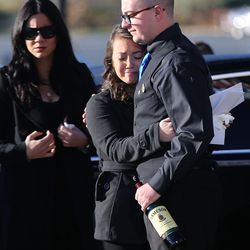 Jessica Le, fiancee of fallen West Valley police officer Cody Brotherson, hugs Cody's brother, Braydon Brotherson, as they arrive for Cody's funeral at the Maverik Center in West Valley City on Monday, Nov. 14, 2016.