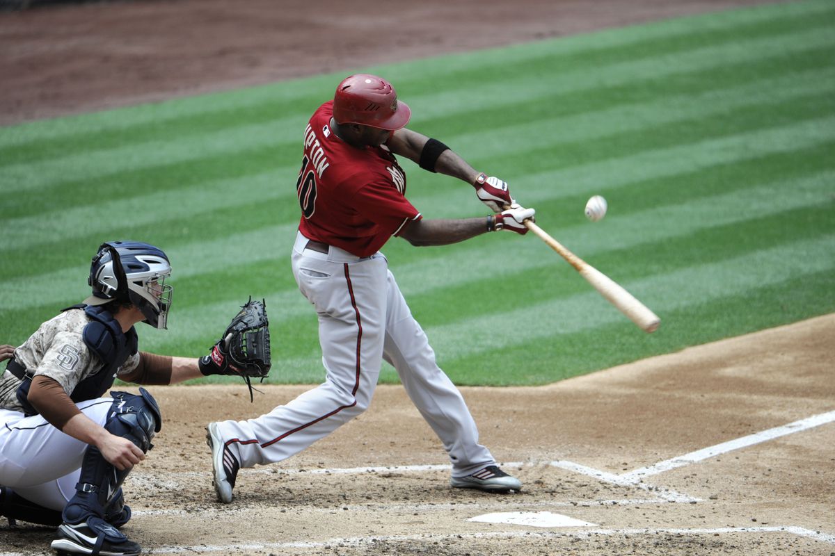 SAN DIEGO, CA:  Justin Upton #10 of the Arizona Diamondbacks flies out during the third inning of a baseball game against the San Diego Padres  at Petco Park in San Diego, California.  (Photo by Denis Poroy/Getty Images)