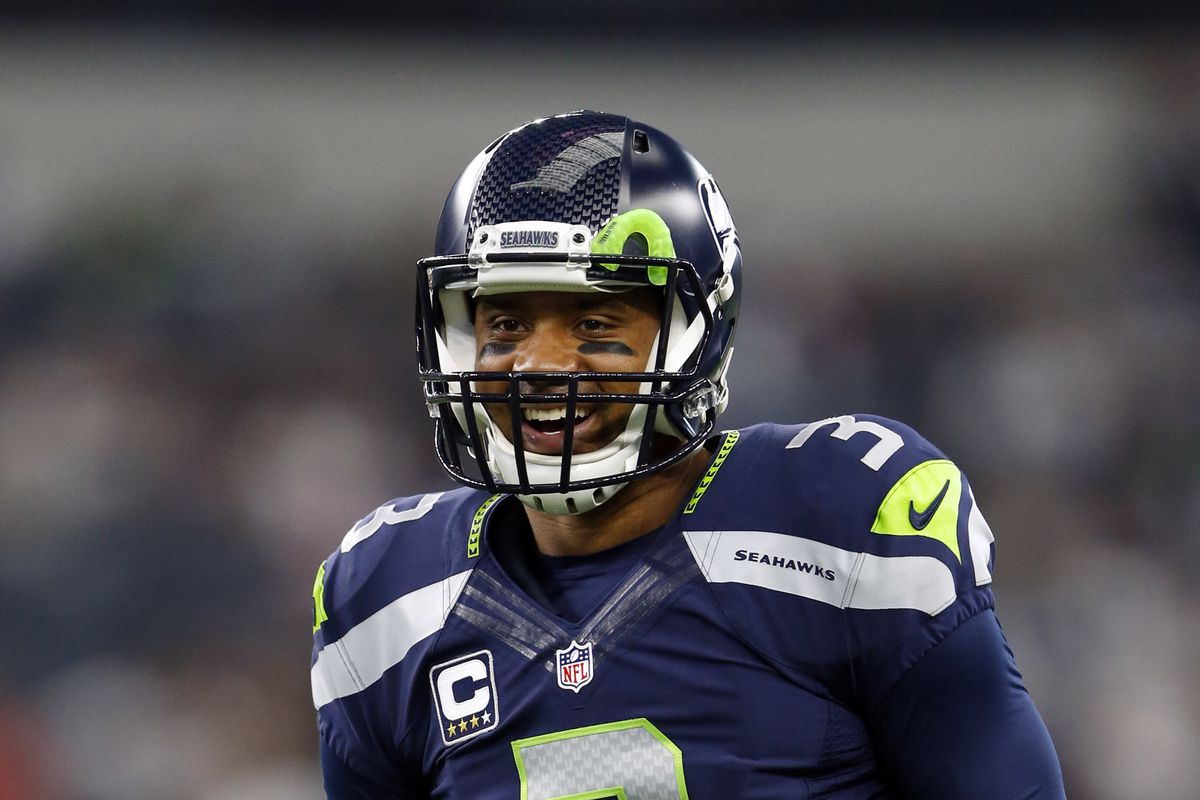 Seattle Seahawks QB Russell Wilson chuckles during a Week 8 game against the Dallas Cowboys, Nov. 1, 2015.