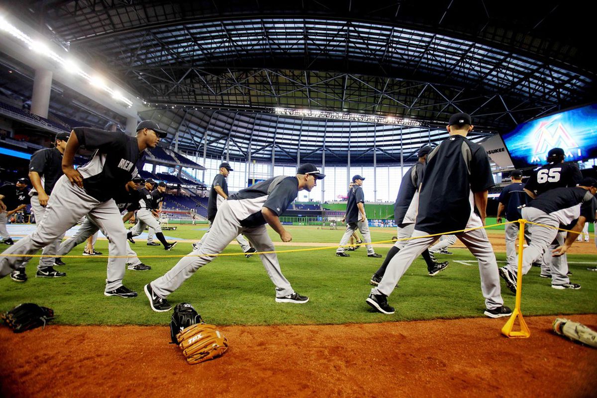 April 1, 2012; Miami, FL, USA;  New York Yankees players stretch before a game against the Miami Marlins at Marlins Park. Mandatory Credit: Robert Mayer-US PRESSWIRE