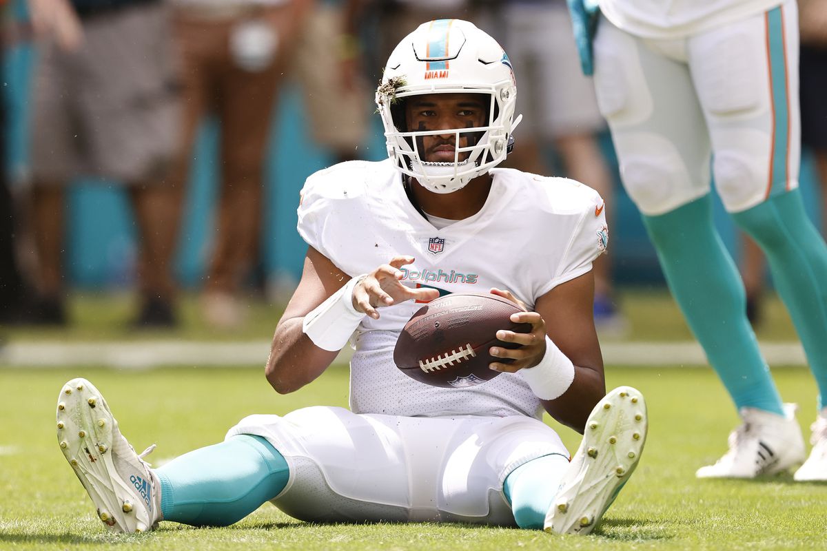 Tua Tagovailoa #1 of the Miami Dolphins reacts after being sacked against the Buffalo Bills during the first quarter at Hard Rock Stadium on September 19, 2021 in Miami Gardens, Florida.