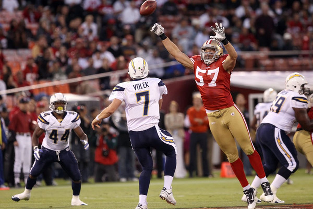 SAN FRANCISCO - SEPTEMBER 02:  Matt Wilhelm #57 of the San Francisco 49ers tries to block a pass by  Billy Volek #7 of the San Diego Chargers at Candlestick Park  on September 2 2010 in San Francisco California.  (Photo by Ezra Shaw/Getty Images)