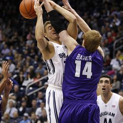 Brigham Young Cougars guard Chase Fischer (1) shoots as Portland's Riley Barker blocks him as Brigham Young University defeats Portland 97-88 in NCAA men's basketball Monday, Dec. 29, 2014, in Provo.  
